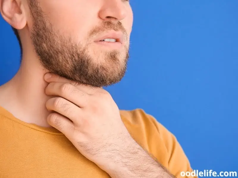 man holds Adam's apple