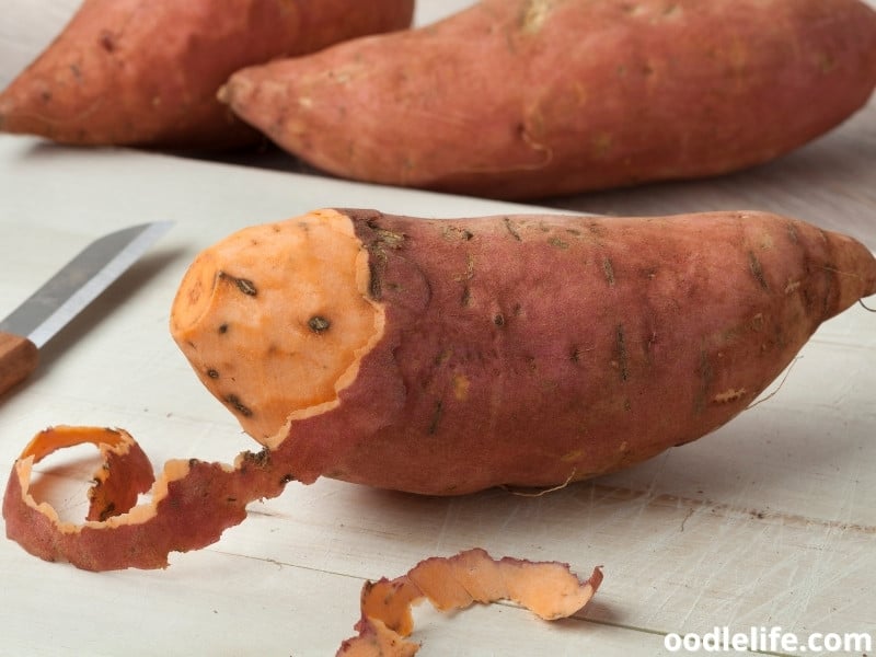 sweet potatoes being peeled