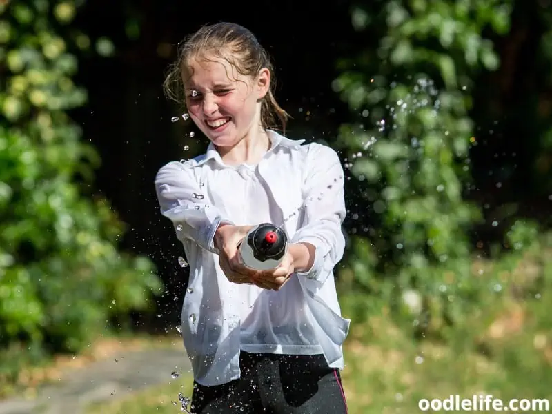 girl squirt water outside