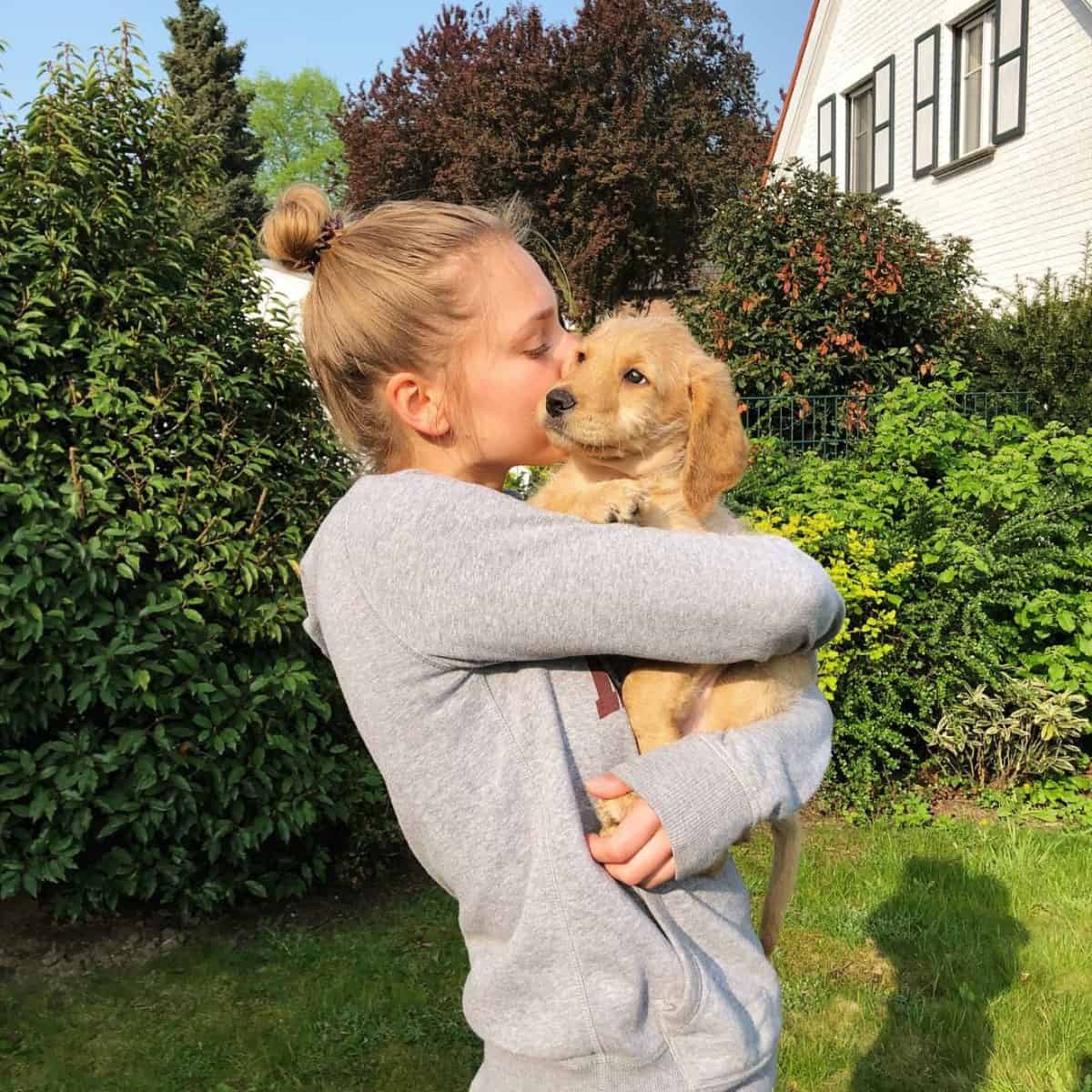 Labradoodle and girl owner