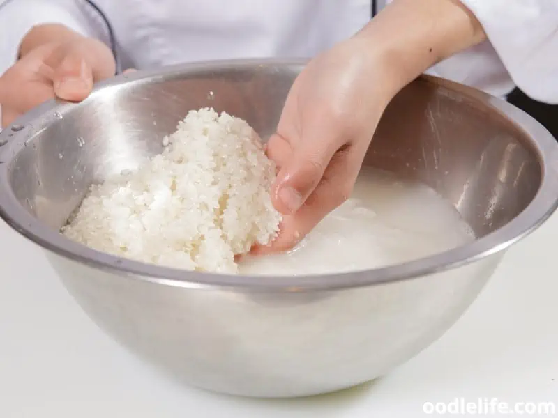 cleaning rice in a bowl
