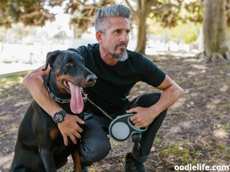 man with his Doberman