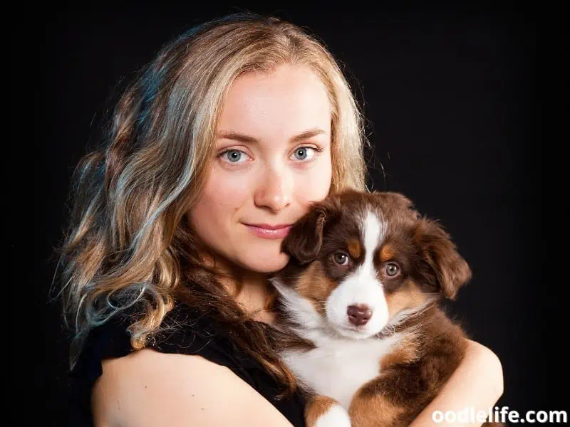 blonde woman and a puppy